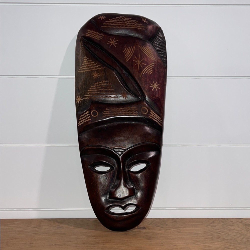 Handcrafted Wooden Mask with Intricate Patterns